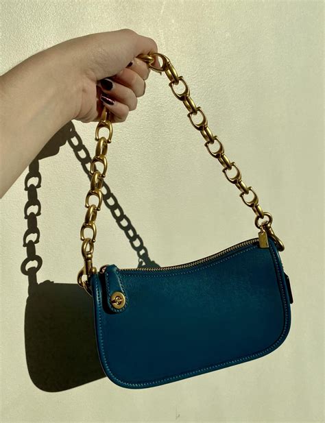 coach purse with chain strap.